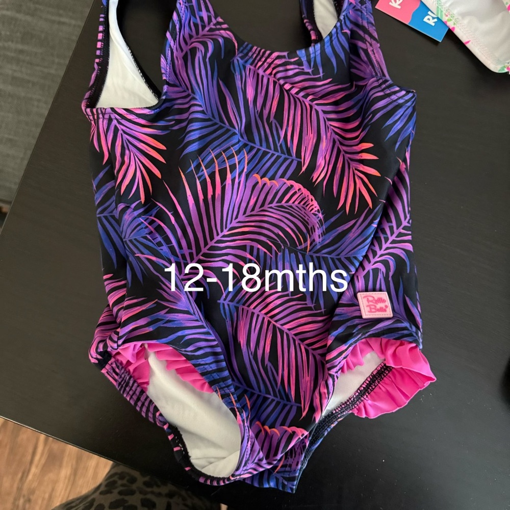 Ruffle Butts Black One-Piece Swimsuit with Pink & Purple Palm Print
